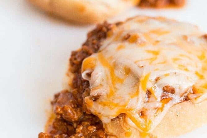 2 pieces of buns with Sloppy Joes and cheese on top