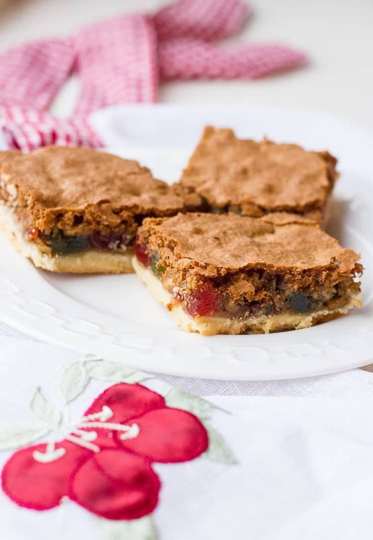 3 slices of Walnut Cherry Slice Bars in a white plate