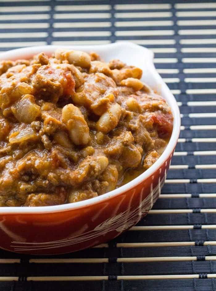 Pumpkin white bean chili in a Pyrex Autumn Harvest casserole dish