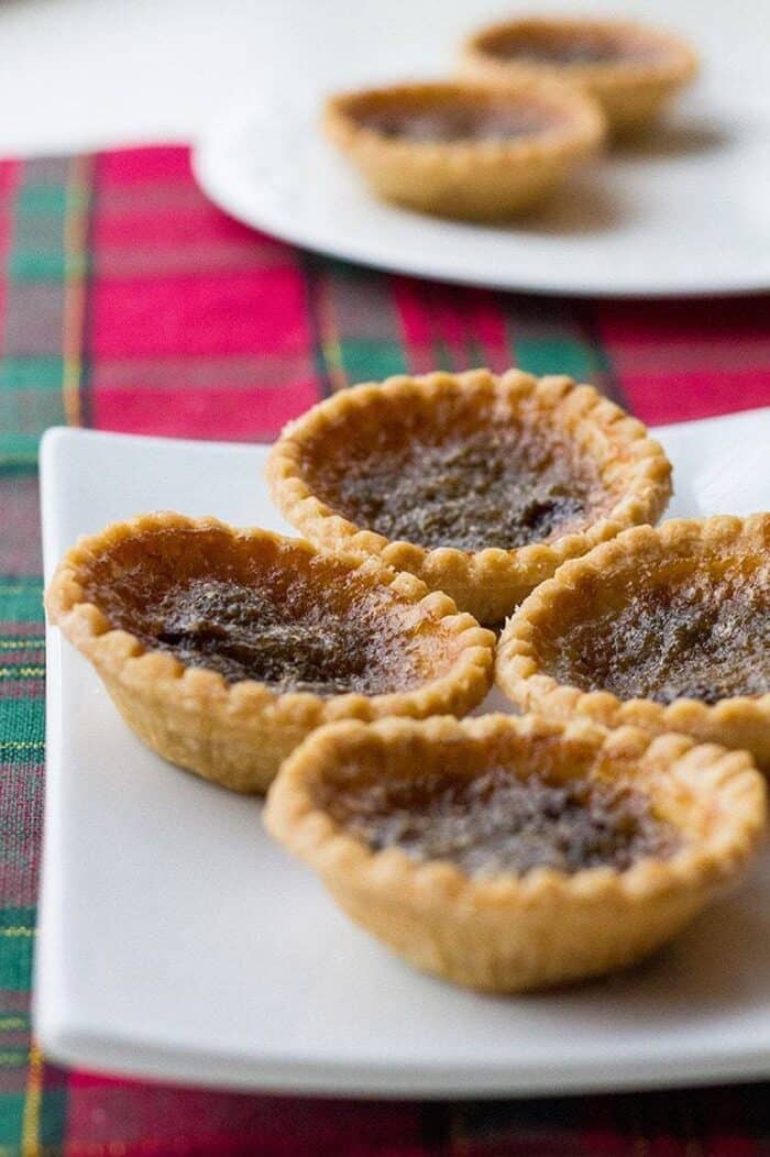 freshly baked Classic Canadian Butter Tarts in a white plate