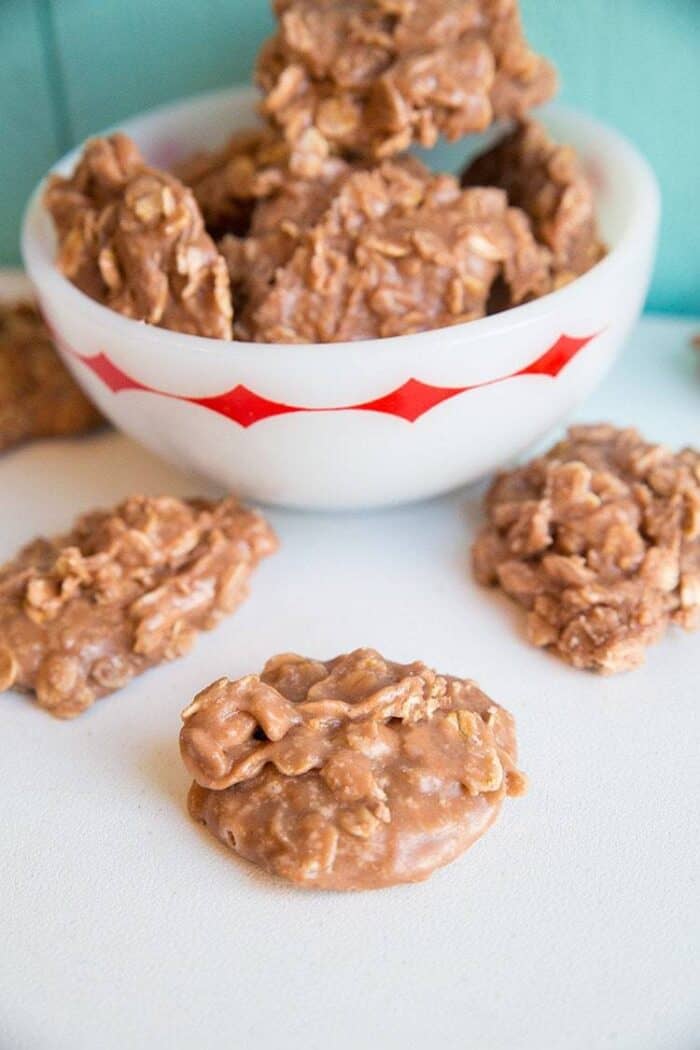 Close up of Chocolate Peanut Butter Oatmeal Cookies in a bowl and around it