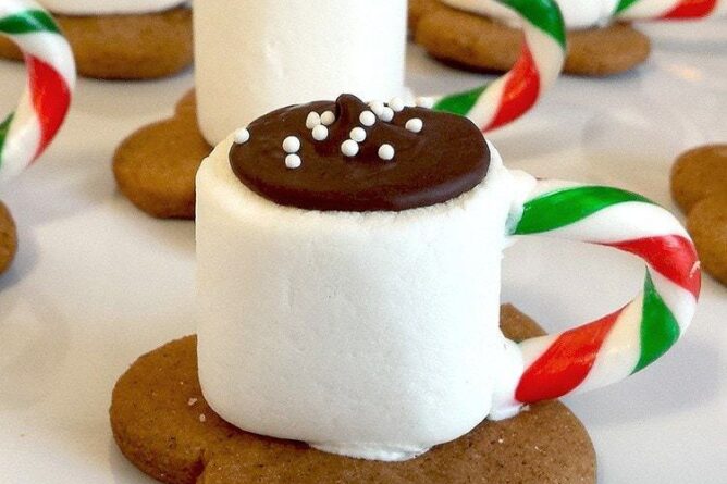 cookies that looks like cup of cocoa on top of a gingersnap cookies