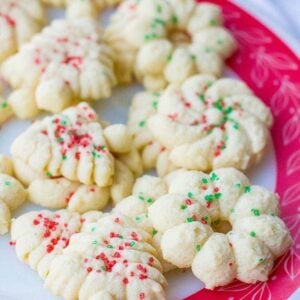 Old Fashioned Classic Spritz Cookies of different shapes sprinkled with candies colored sugar