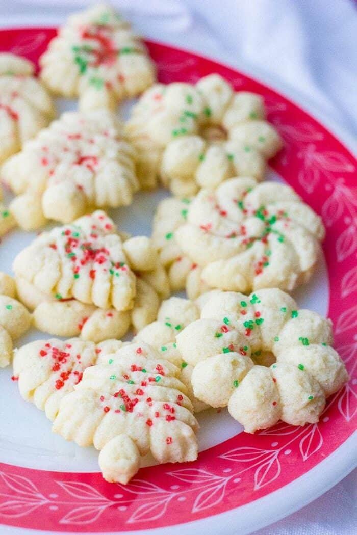 Old Fashioned Classic Spritz Cookies of different shapes sprinkled with candies colored sugar