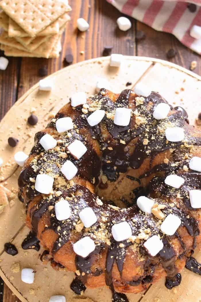 S'mores Monkey Bread topped with marshmallows and crushed nuts