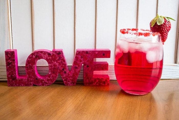 Cocktail Glass with Valentine's Day Cocktail - Scarlet Kiss with glass rim dipped in red sugar