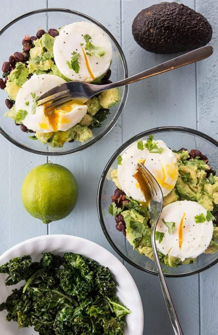 two servings of Tex Mex Kale Breakfast Bowl with poached eggs on top
