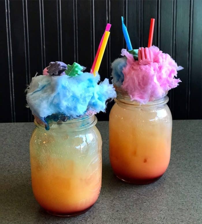 cotton candy crush - two drinks with cotton candy and gum on the top & candy straws