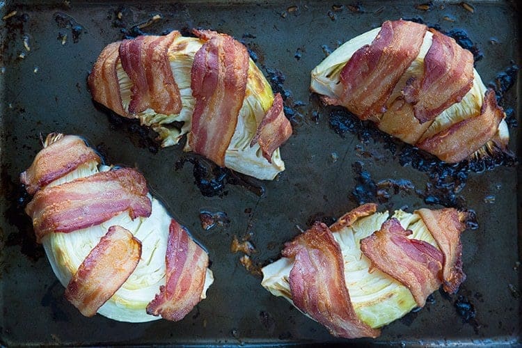 Bacon Wrapped Roasted Cabbage Wedges in a large baking sheet