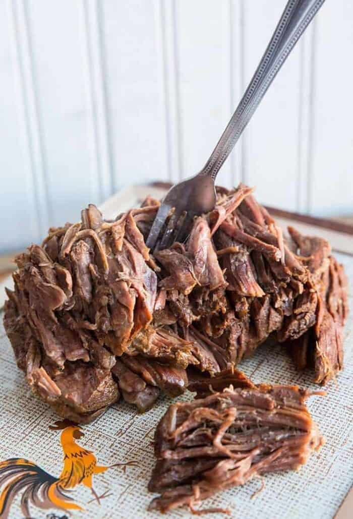cooked Blade/Chuck Roast, shredded beef in a fork 