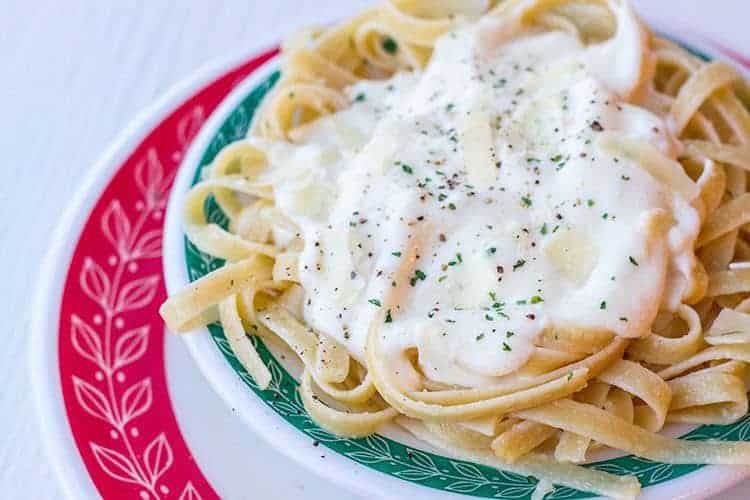 Alfredo Sauce With Cream Cheese Served Over Pasta in a Plate with Green Prints