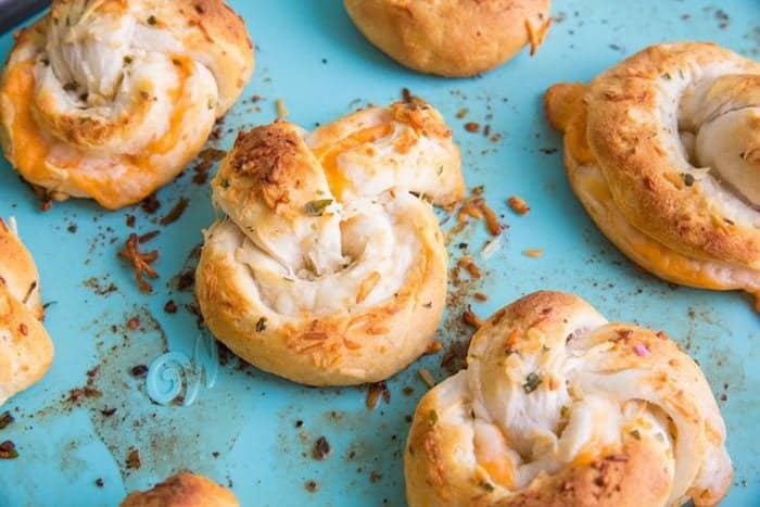 Cheese Stuffed Garlic Knots on jade blue background