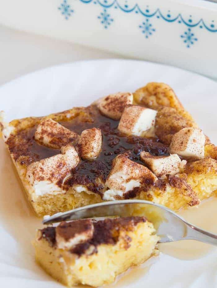 getting a part of Cinnamon Maple Cream Cheese Baked French Toast using fork