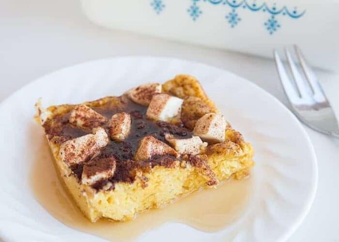 White Plate with Baked French Toast with Cinnamon, Maple Syrup and Cream Cheese 