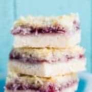Close up Stack of Coconut Grape Jam Bars in a White bow printed with blue