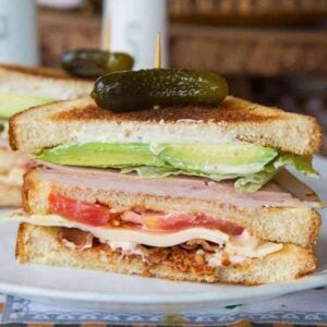 Clubhouse Sandwich topped with Gherkins pickles
