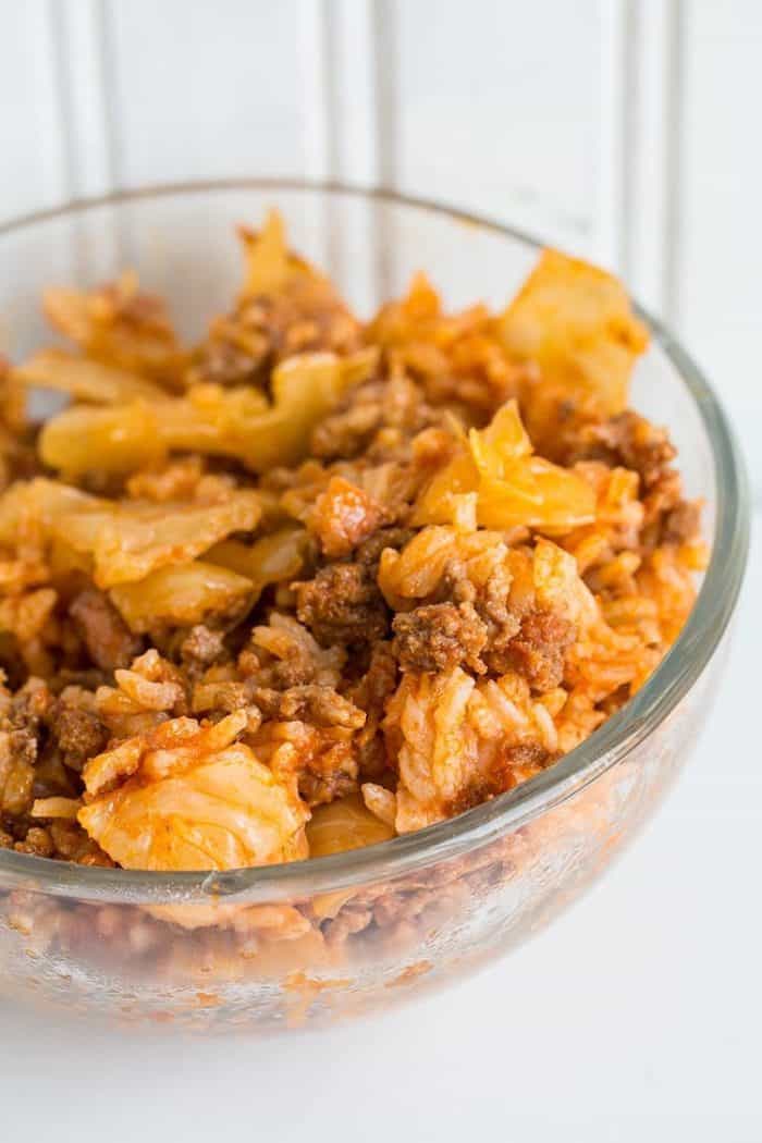 Lazy Cabbage Casserole in a transparent bowl on white background