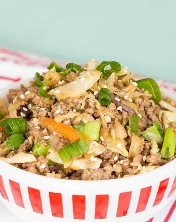 low carb crack slaw in red striped bowl