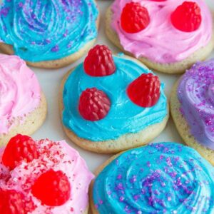 close up plate of colorful Old Fashioned Cut-Out Sour Cream Sugar Cookies with different toppings