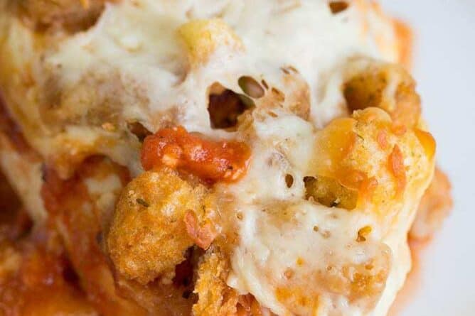 Close up Parmesan Chicken Casserole Topped with crunchy garlic croutons and cheese, this is the perfect supper!