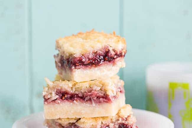 stack of Raspberry Coconut Bars in a white bowl