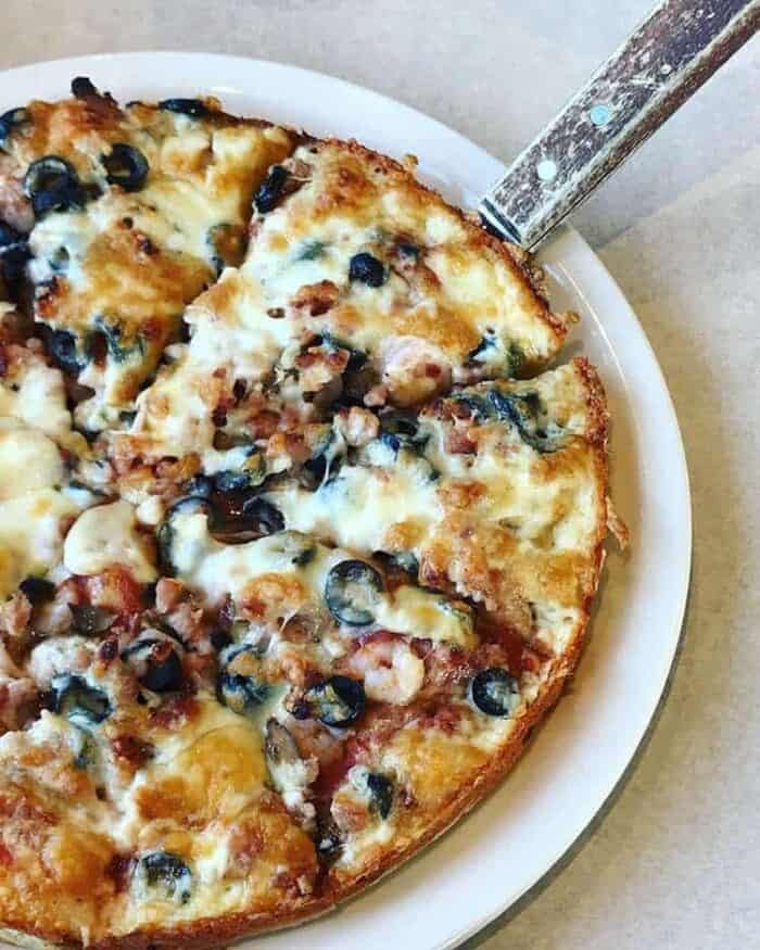 pizza with bacon, black olive, mushroom and shrimp