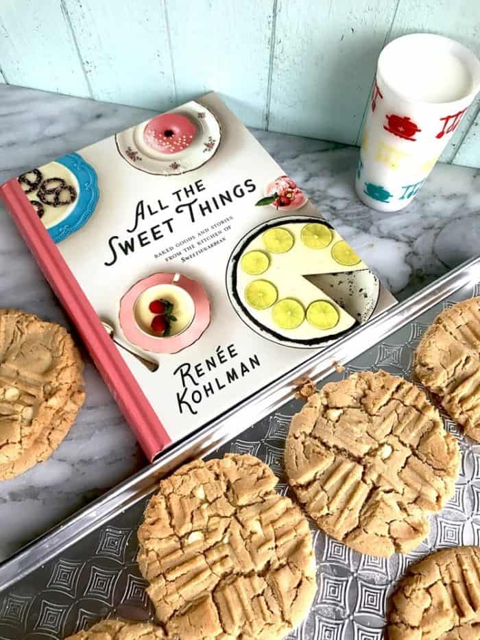 Renée Kolhman cookbook with giant white chocolate peanut butter cookies around it