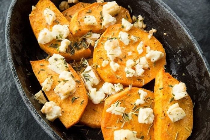 Top down shot of Baked Herbed Sweet Potatoes & Feta in Large Bowl