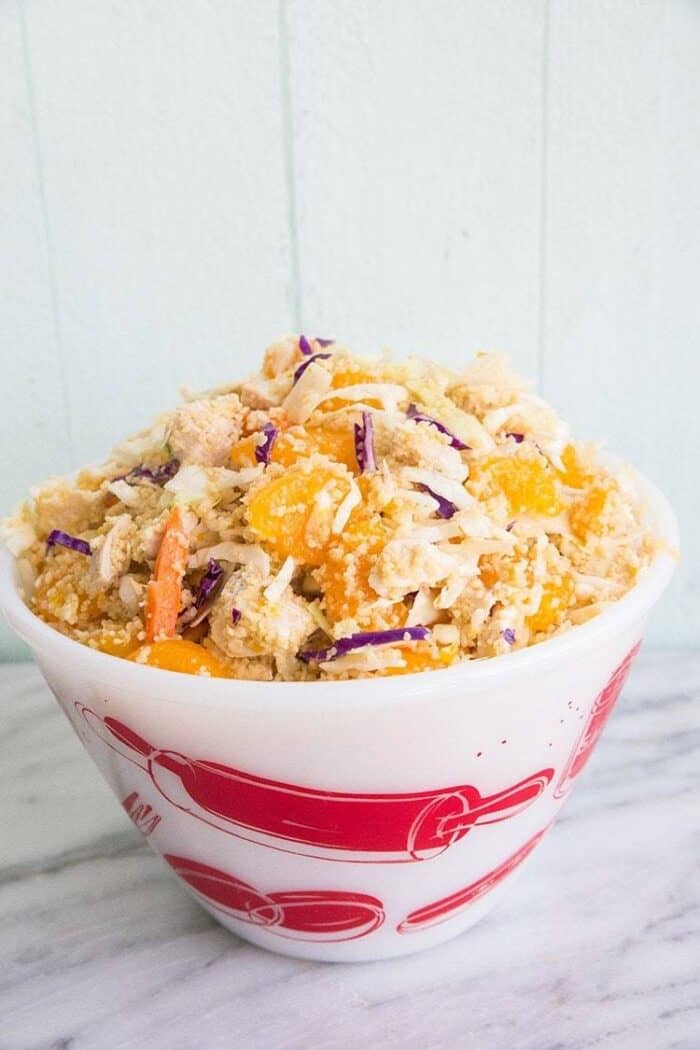 Ginger Citrus Chicken Couscous Coleslaw with sesame dressing on top
