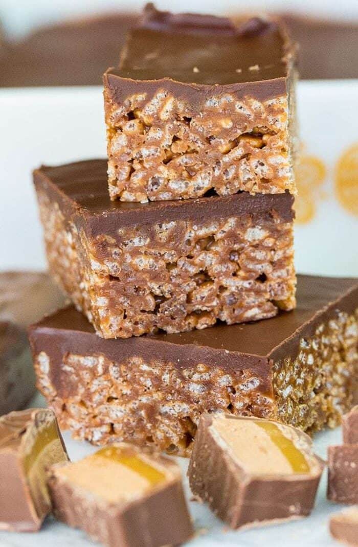 close up stack of Mars Bar Squares showing the Rice Krispies in them