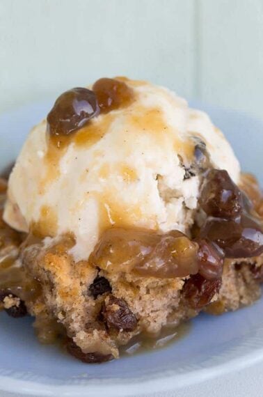 close up of Caramel Pudding Cake with a scoop of vanilla ice cream on top