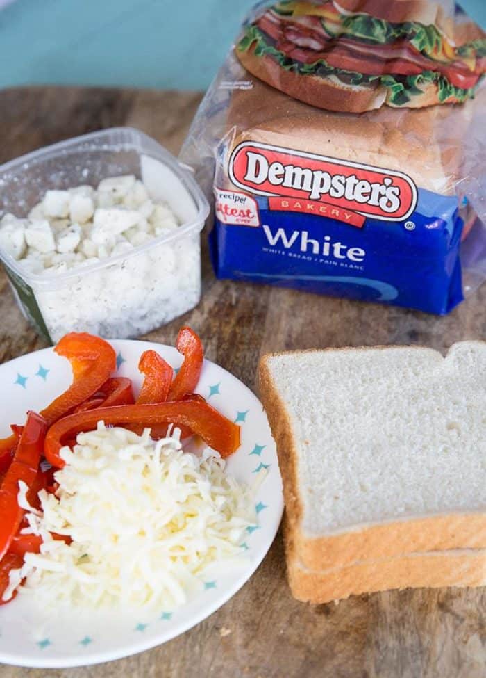 Sliced Red Pepper, Cheese and Bread on board