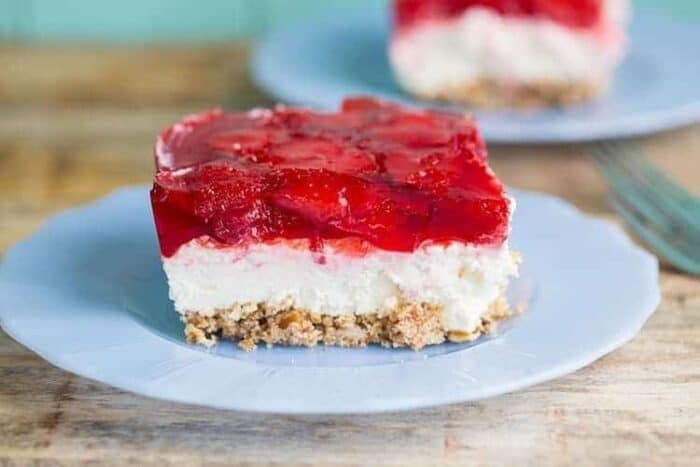 a slice of Strawberry Pretzel Salad in blue plate