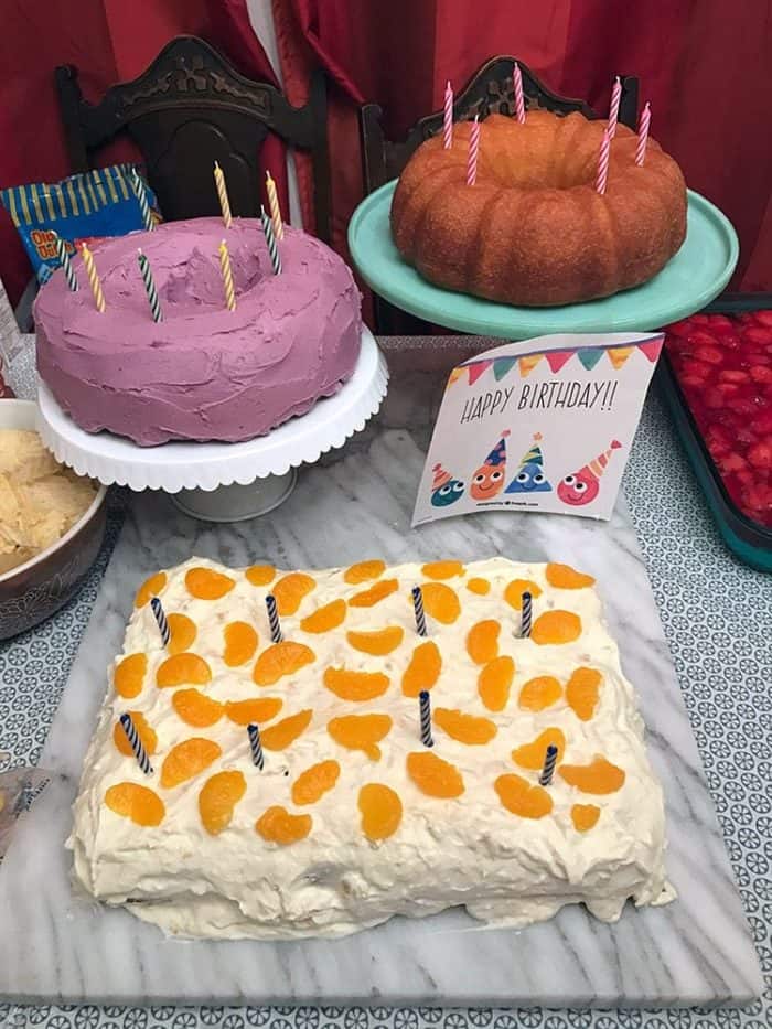 birthday cakes on the table including the Strawberry Pretzel Salad