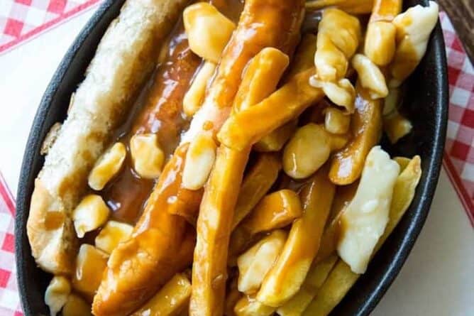 Top down shot of Poutine Hot Dogs with buns