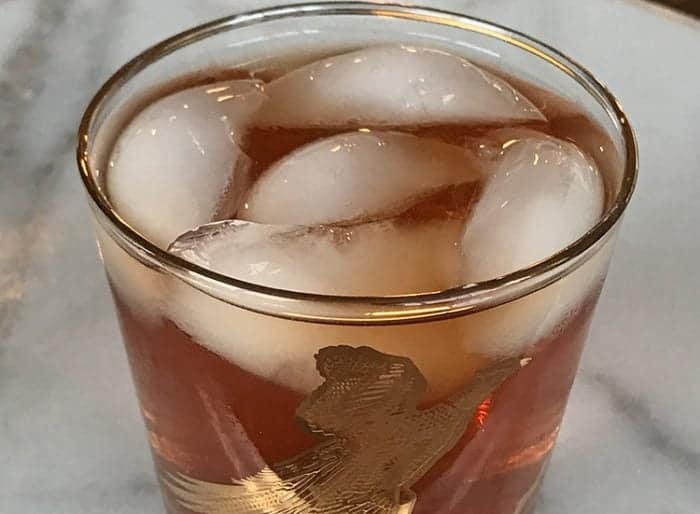 Mickie Walker Cocktail in a vintage bird glass with ice