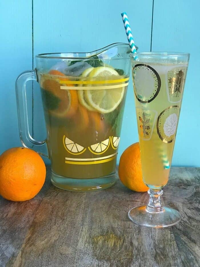 Sparkling Bourbon Lemonade with slices of oranges and mint leaves