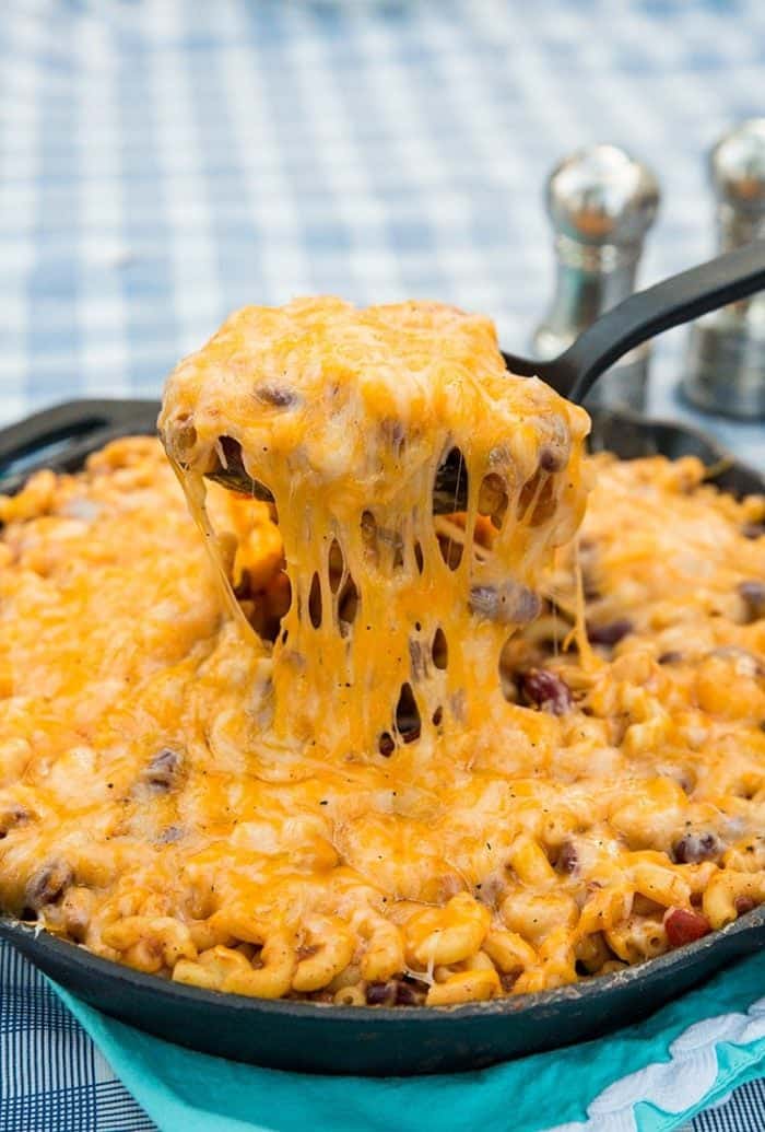 a spoon full of cheesy chili mac skillet 