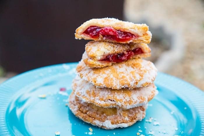 stack of Campfire Cherry Hand Pies in a blue plate