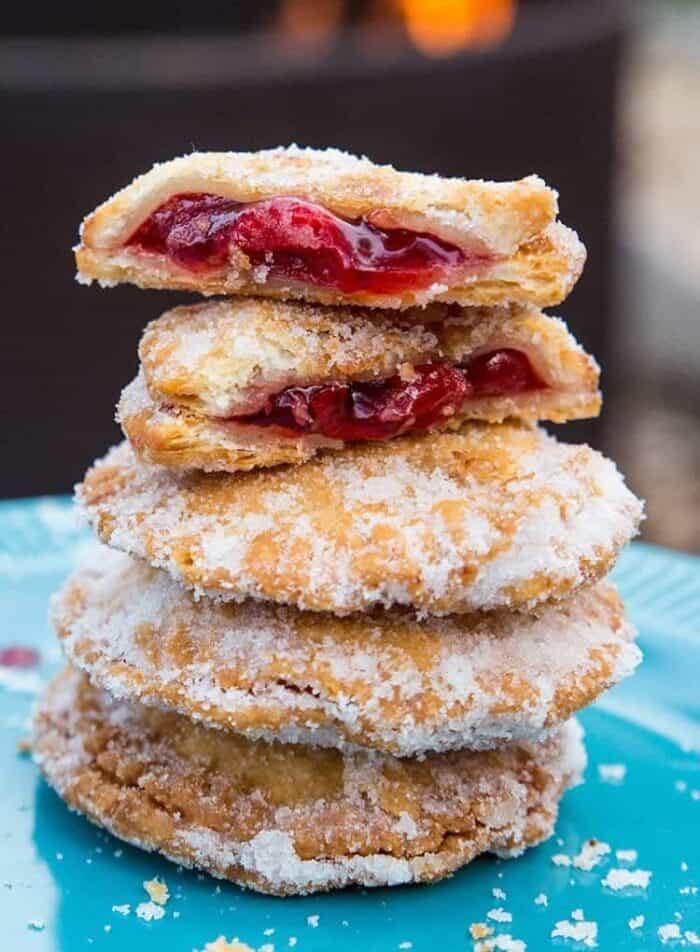 broken piece of Campfire Cherry Hand Pies showing the inside of the pie