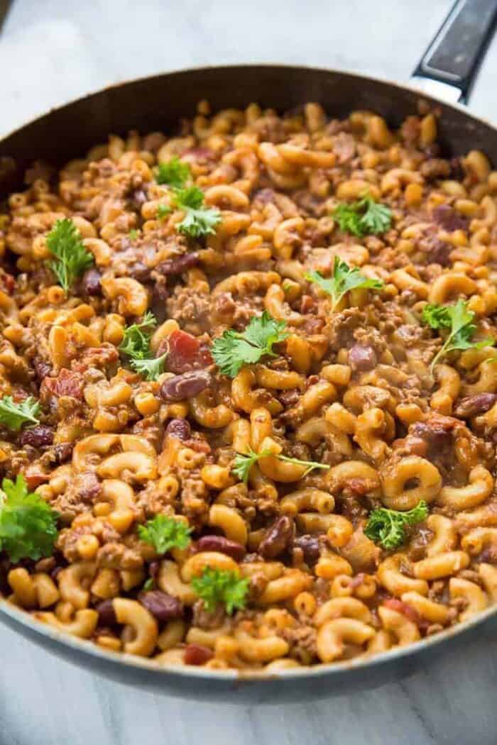 Close up Cheesy Chili Mac Skillet topped with parsley