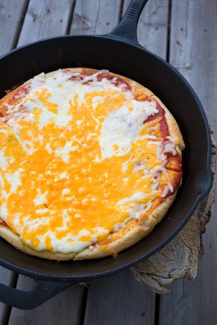 cheesy whole Campfire pizza in a flat pan