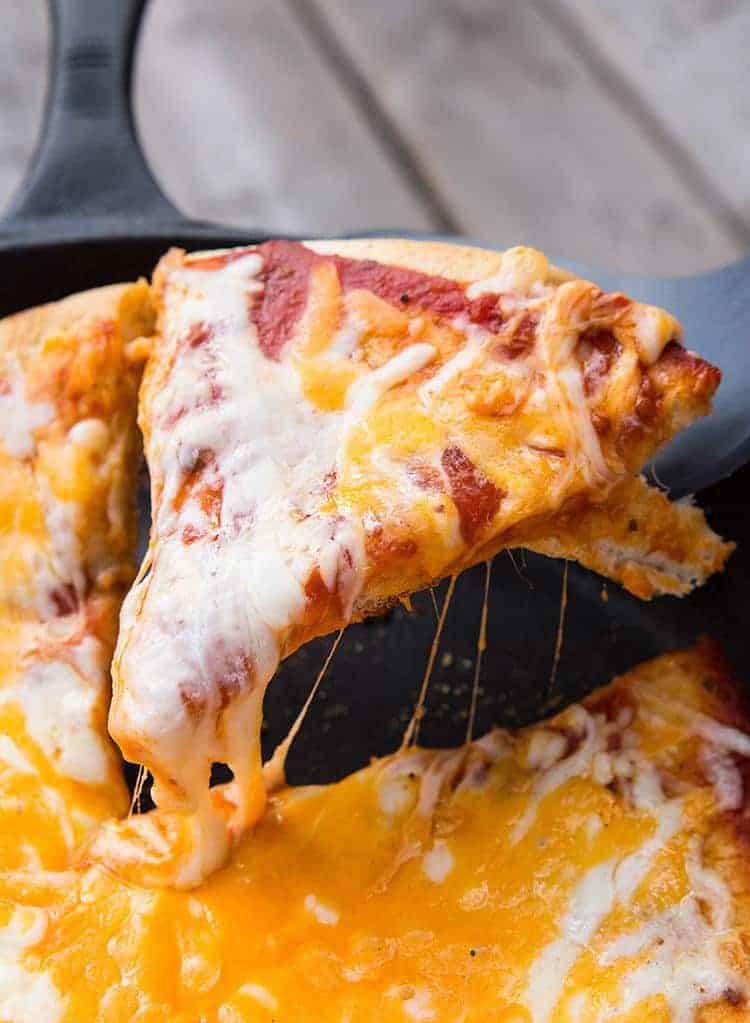 a slice of cheesy campfire pizza