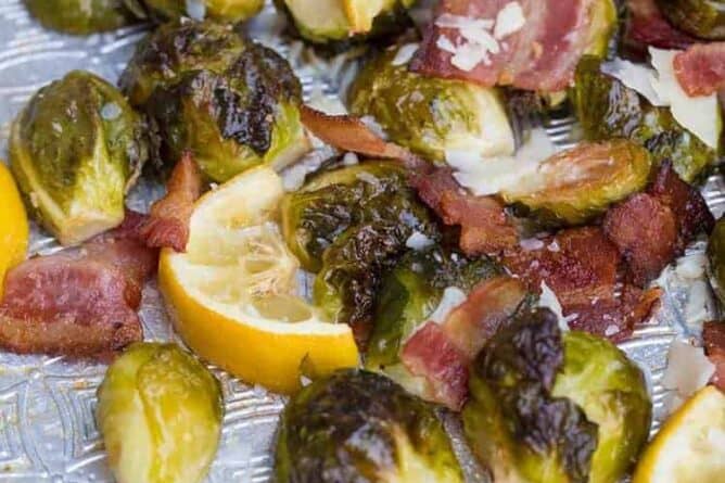 Close up of Crispy Lemon Bacon Roasted Brussels Sprouts in a baking sheet