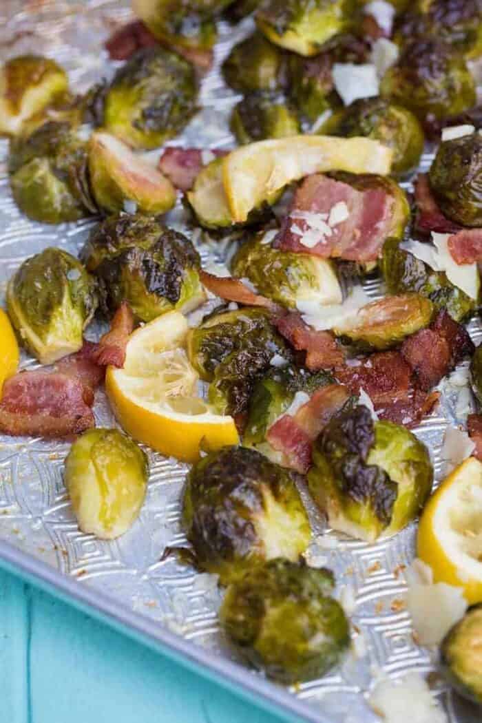 Close up of Crispy Lemon Bacon Roasted Brussels Sprouts in a baking sheet