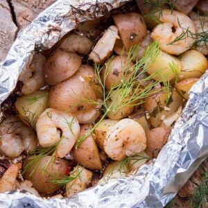 close up Lemon Garlic Shrimp & Potatoes with Dill in Foil Packets