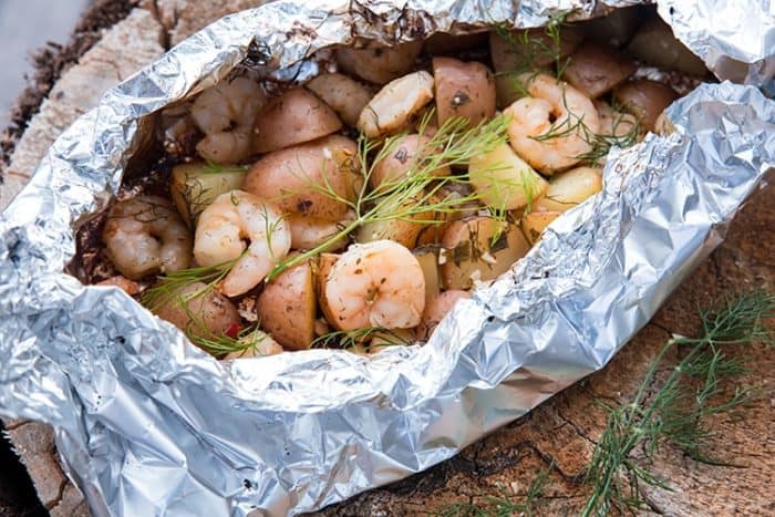 Lemon Garlic Dill Shrimp & Potatoes in Foil Packets. I rarely rough it while camping and these are an easy, delicious meal!