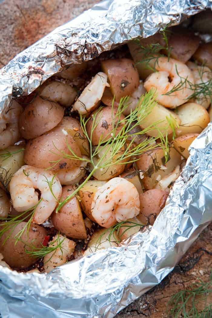 close up Lemon Garlic Shrimp & Potatoes with Dill in Foil Packets 