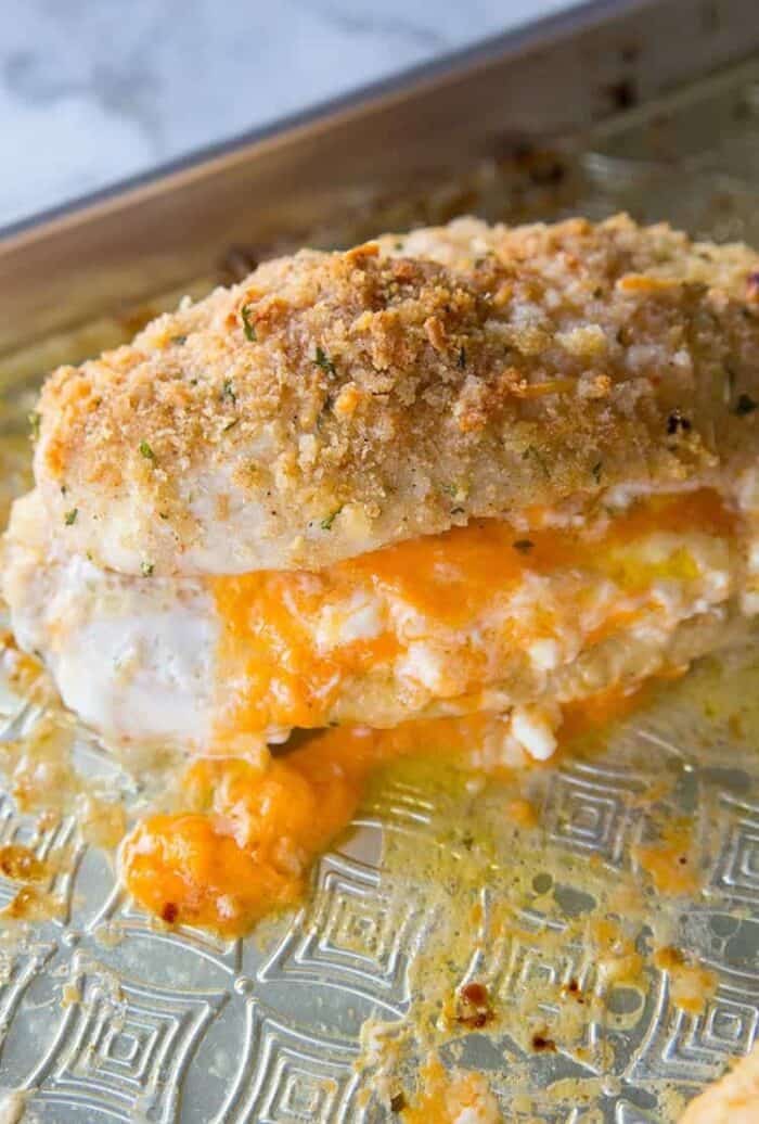 close up of Lemon Garlic Double Cheese Stuffed Chicken in baking sheet