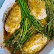 Top down shot of Lemon Chicken with Rosemary & Asparagus in white pan